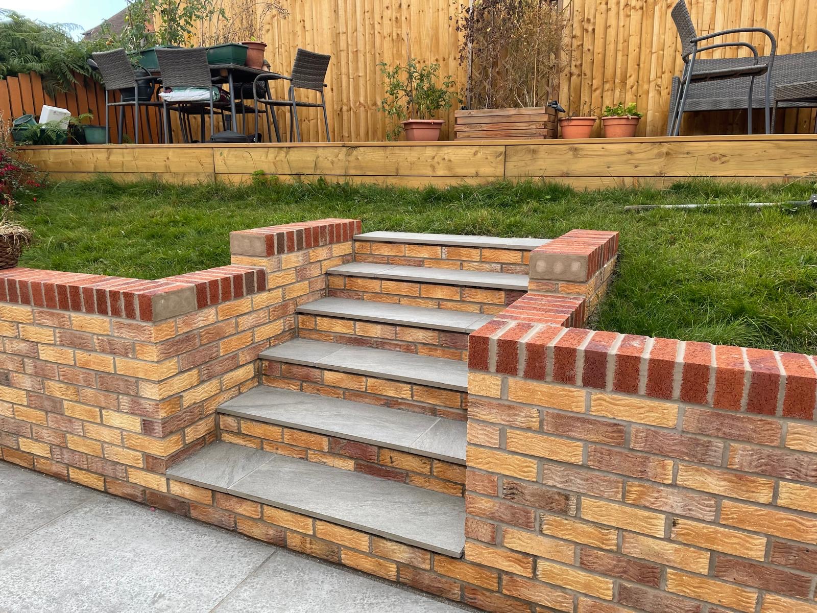 Finished brick garden stairs with grey stone treads